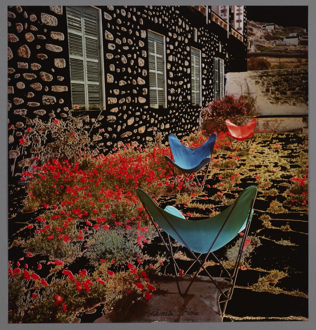 Colorful Chairs in Poppy Garden by Stone House