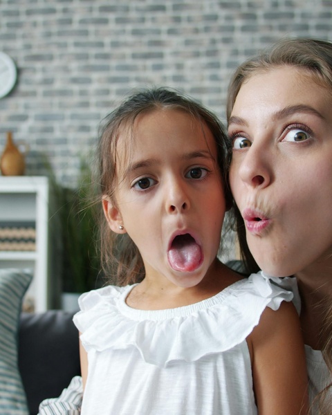 Woman and Girl Making Funny Faces