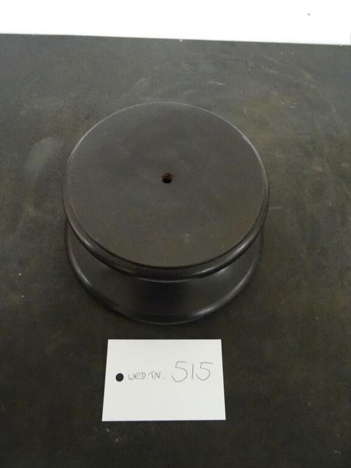 Black Cylindrical Industrial Part with Tag