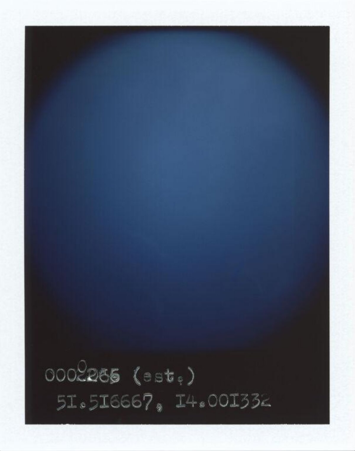 Blue Polaroid With Handwritten Coordinates