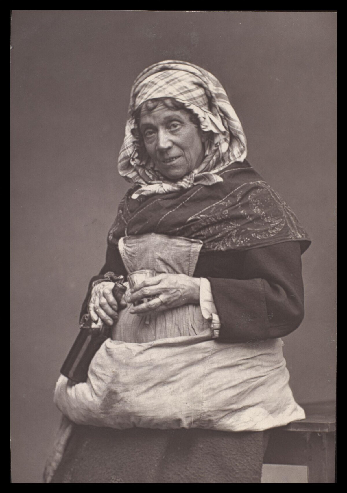 Vintage Portrait of Elderly Woman With Bottle