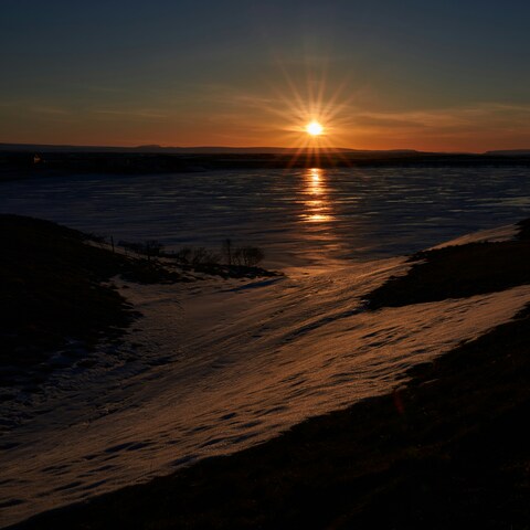Sunset Over Frozen Snowy Lake