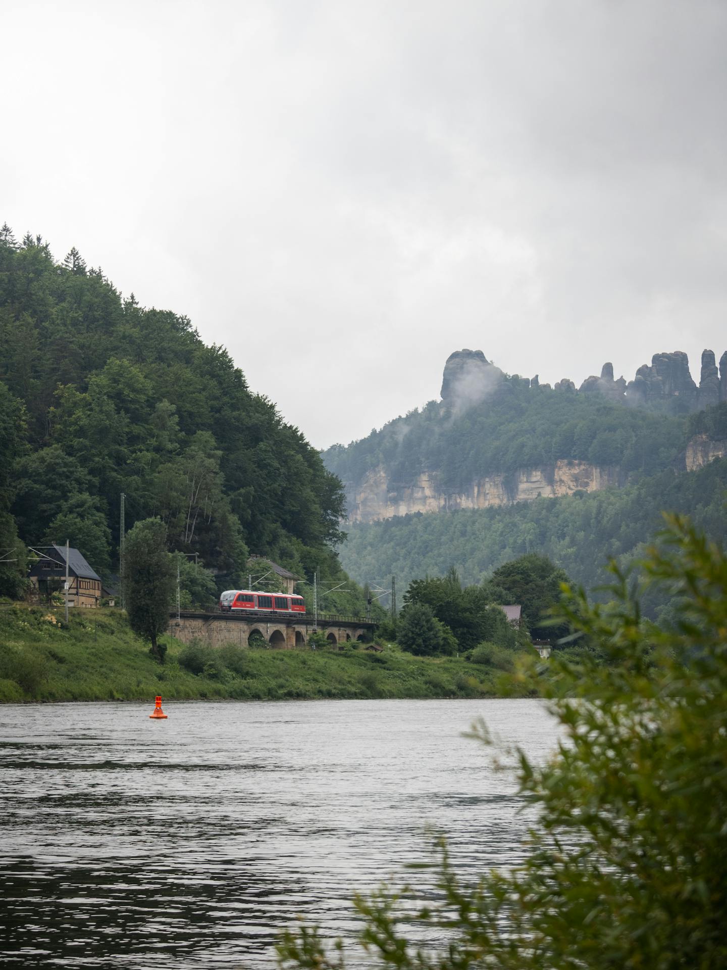 Red Train by River and Cliffs — Backgrounds