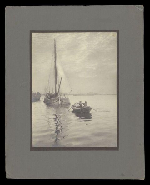 Sailboat and Rowboat on Calm Water