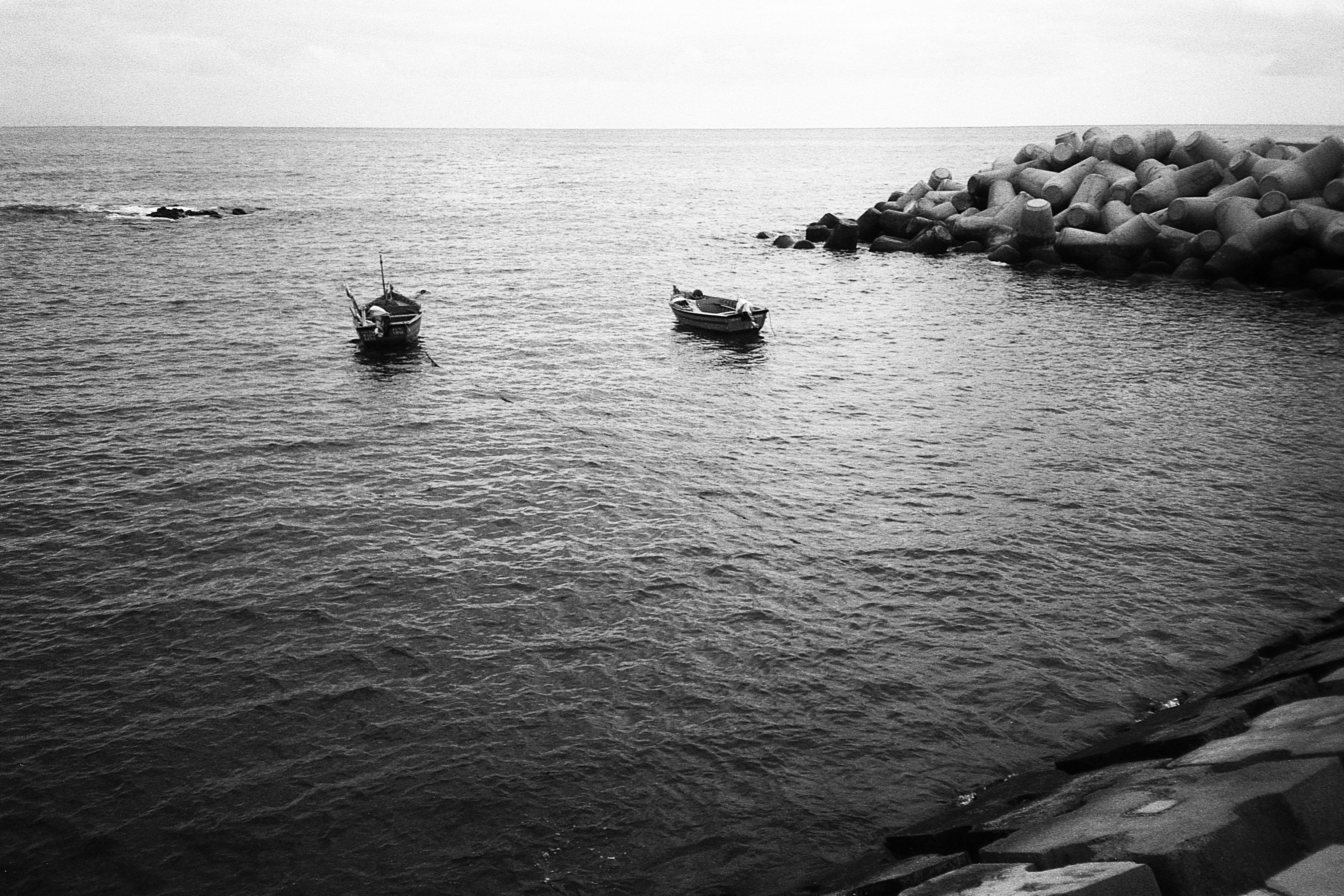 Two Fishing Boats Anchored at Sea