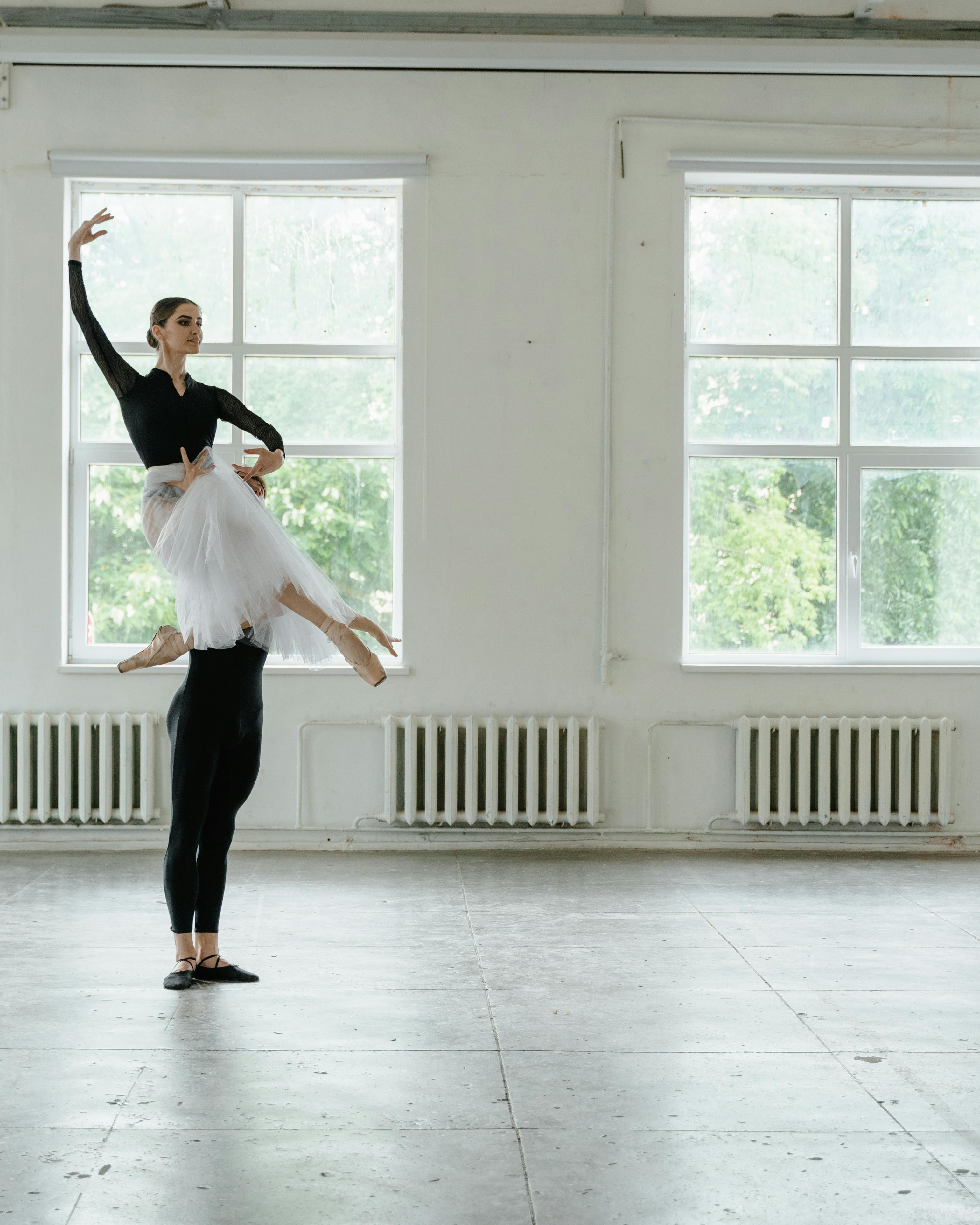 Two Ballet Dancers Rehearsing in Studio