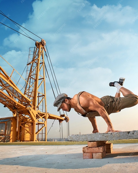 Muscular Construction Worker Working Out On Site