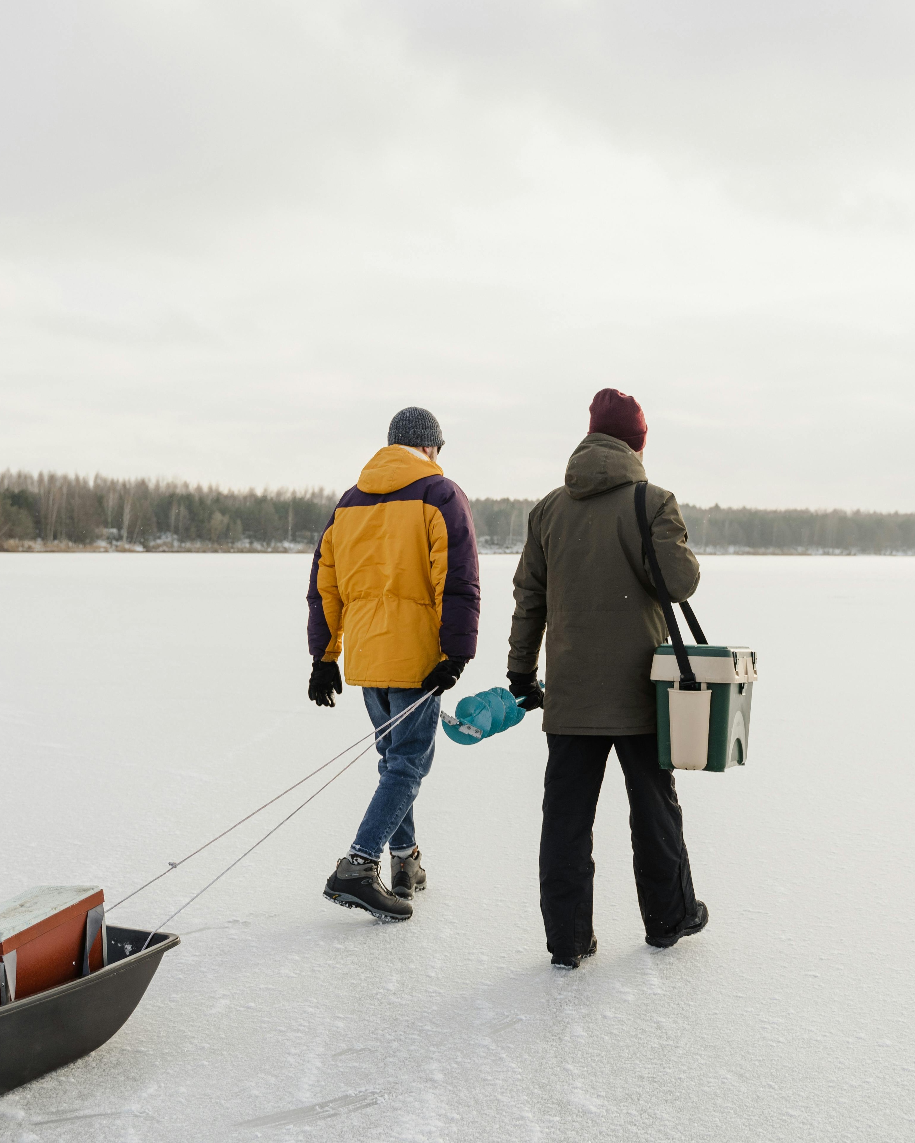 Two Men Heading Out for Ice Fishing