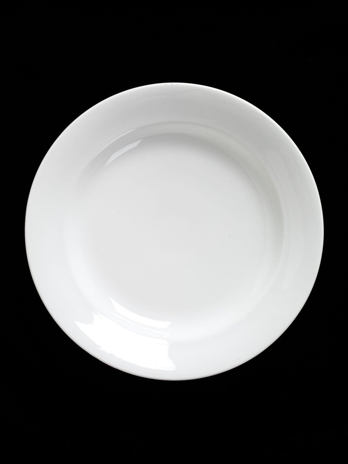 White Plate On Black Background
