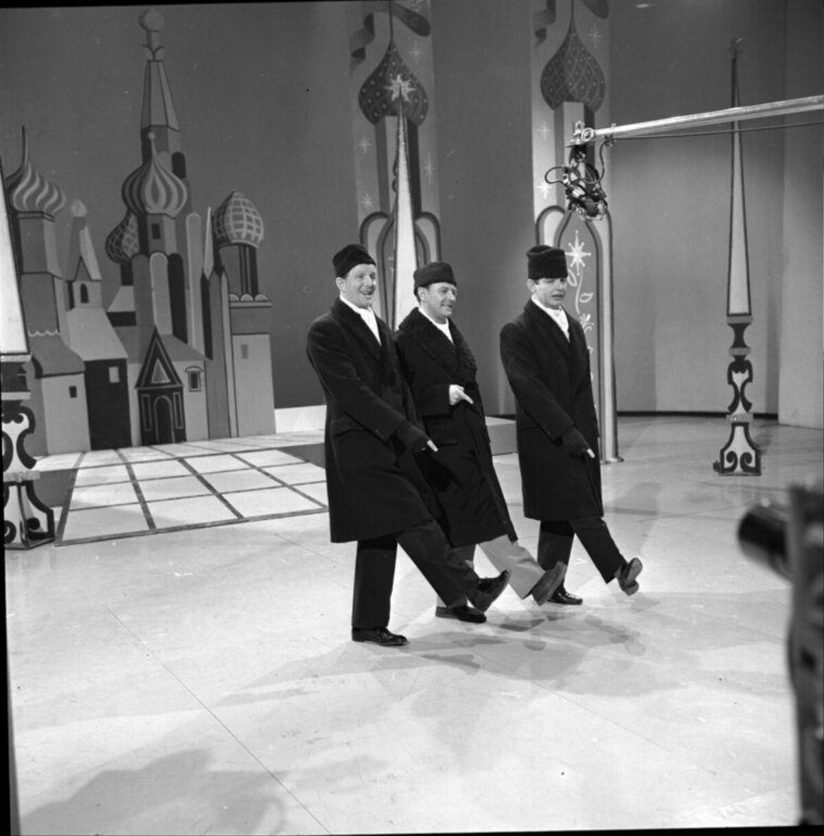 Three Performers Walking on Stage