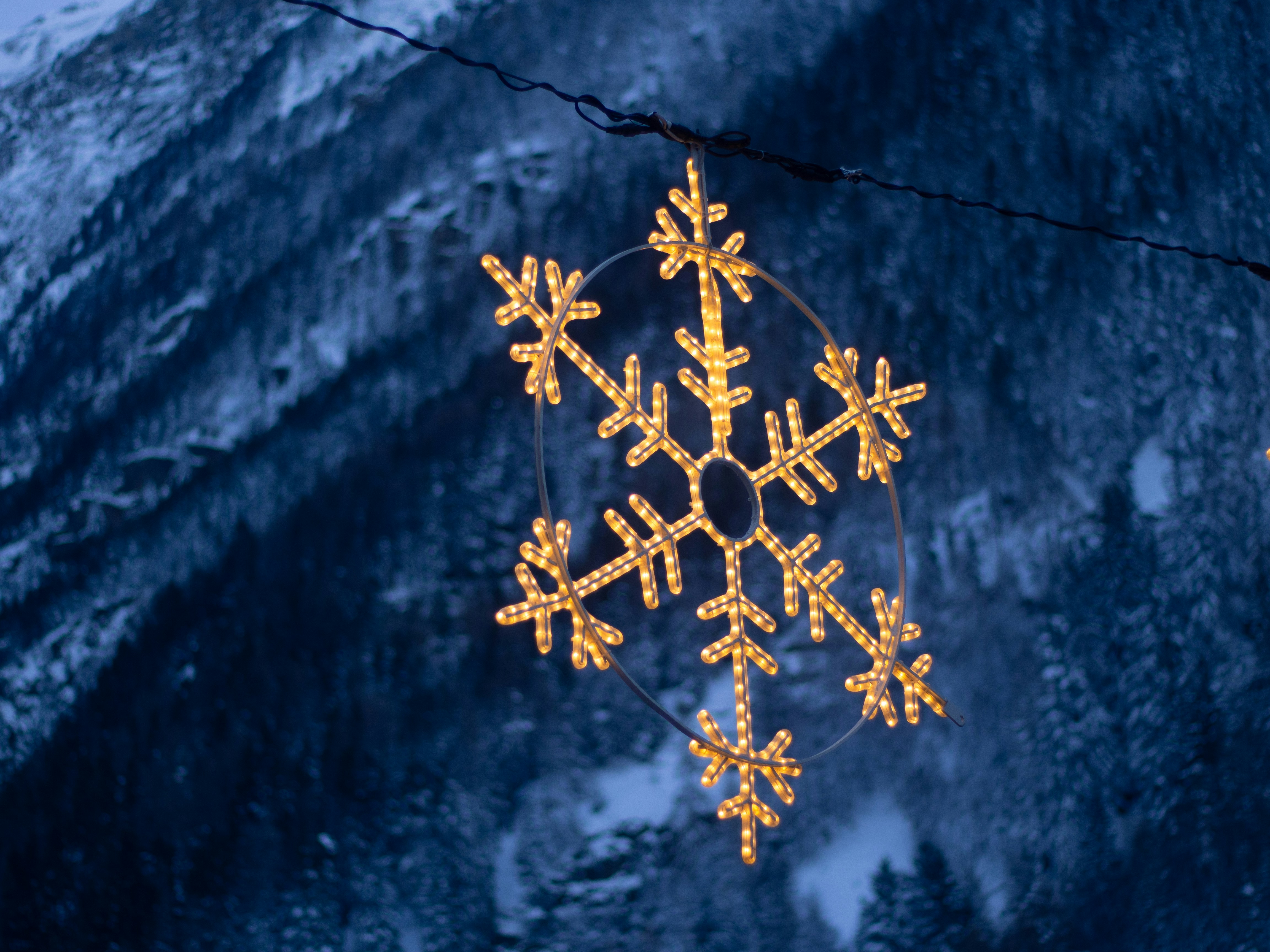 Lit Snowflake Decoration by Snowy Mountain
