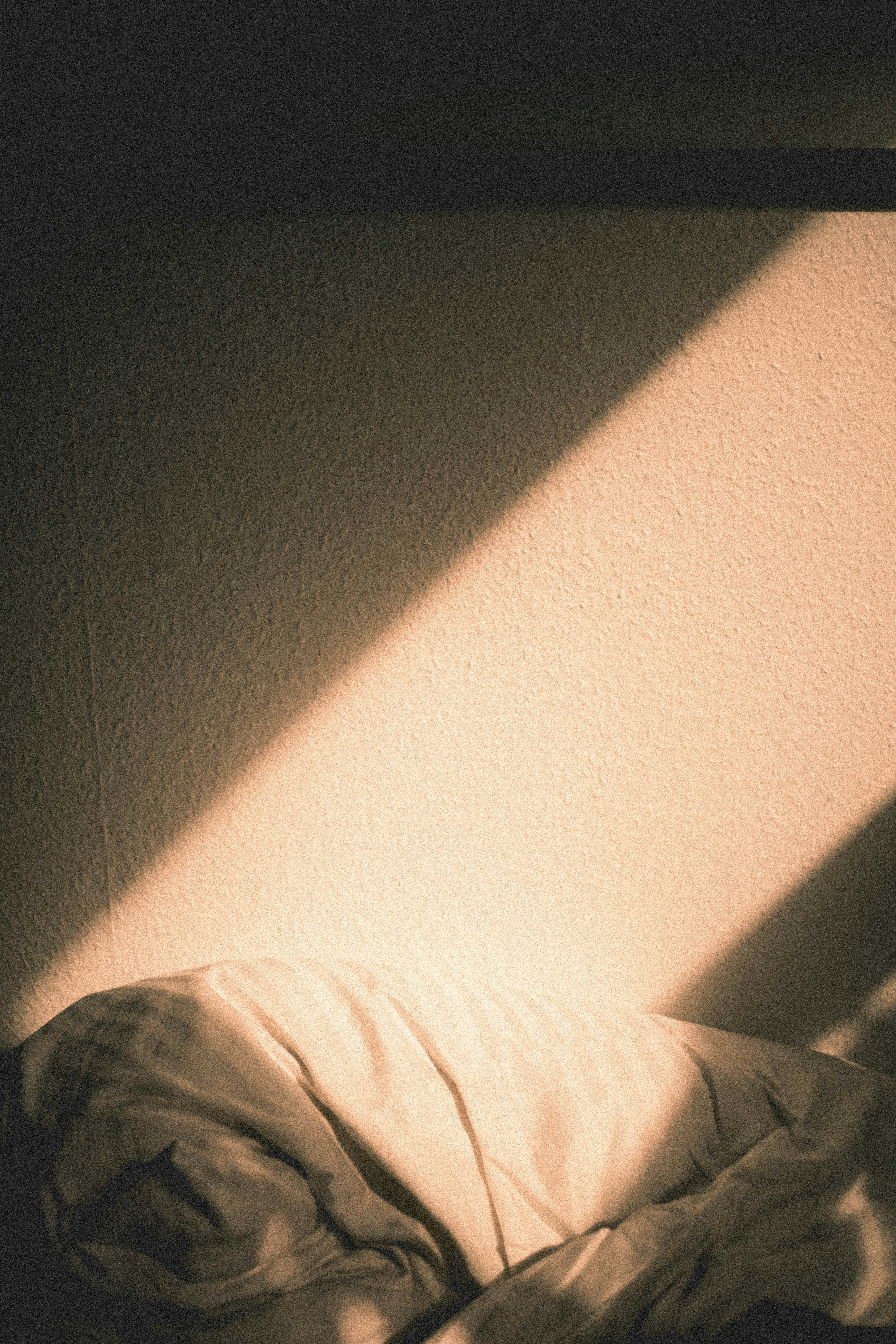 Sunbeam on Bedroom Wall and Bedding