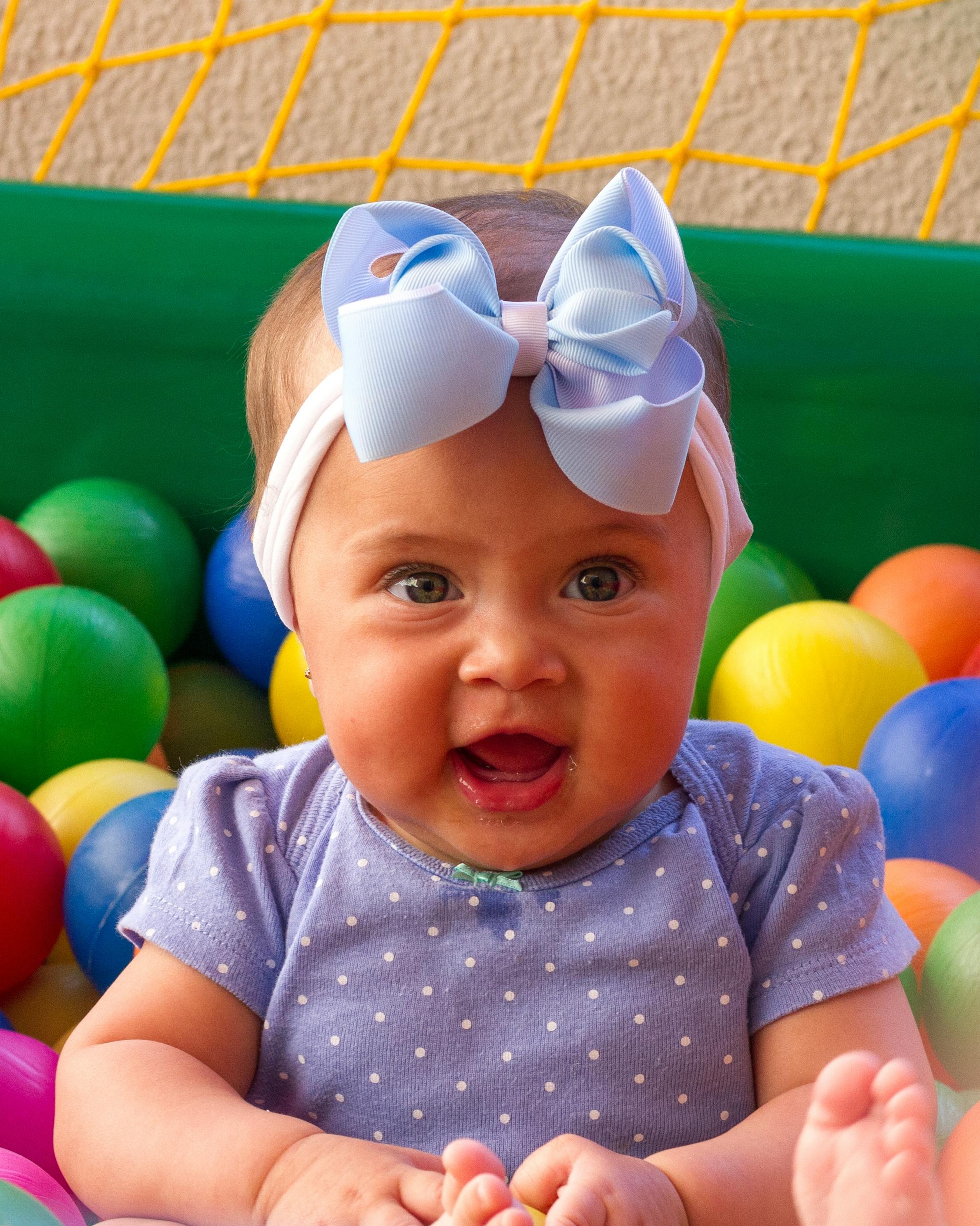 Happy Baby in Colorful Ball Pit