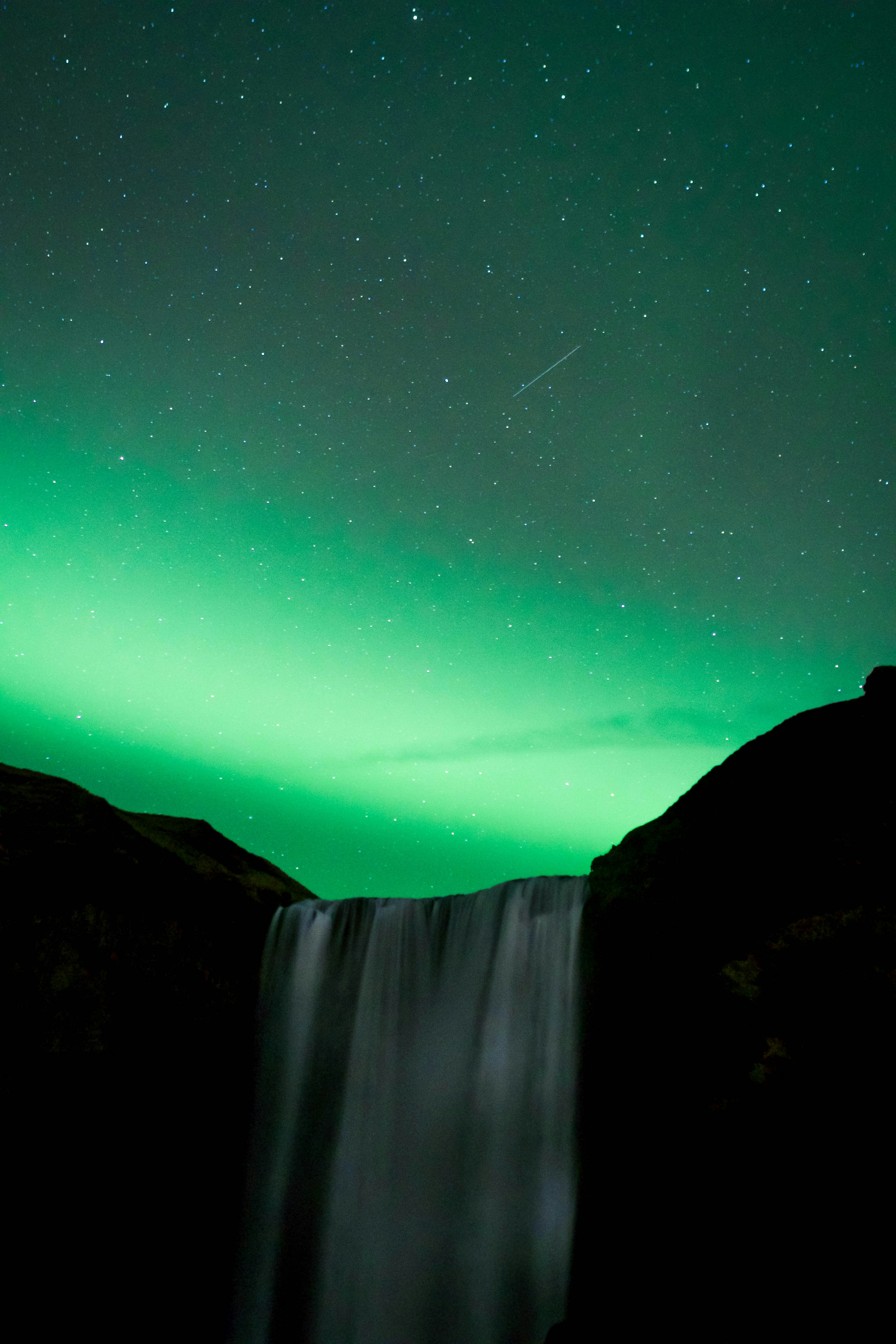 Night Aurora Over Waterfall