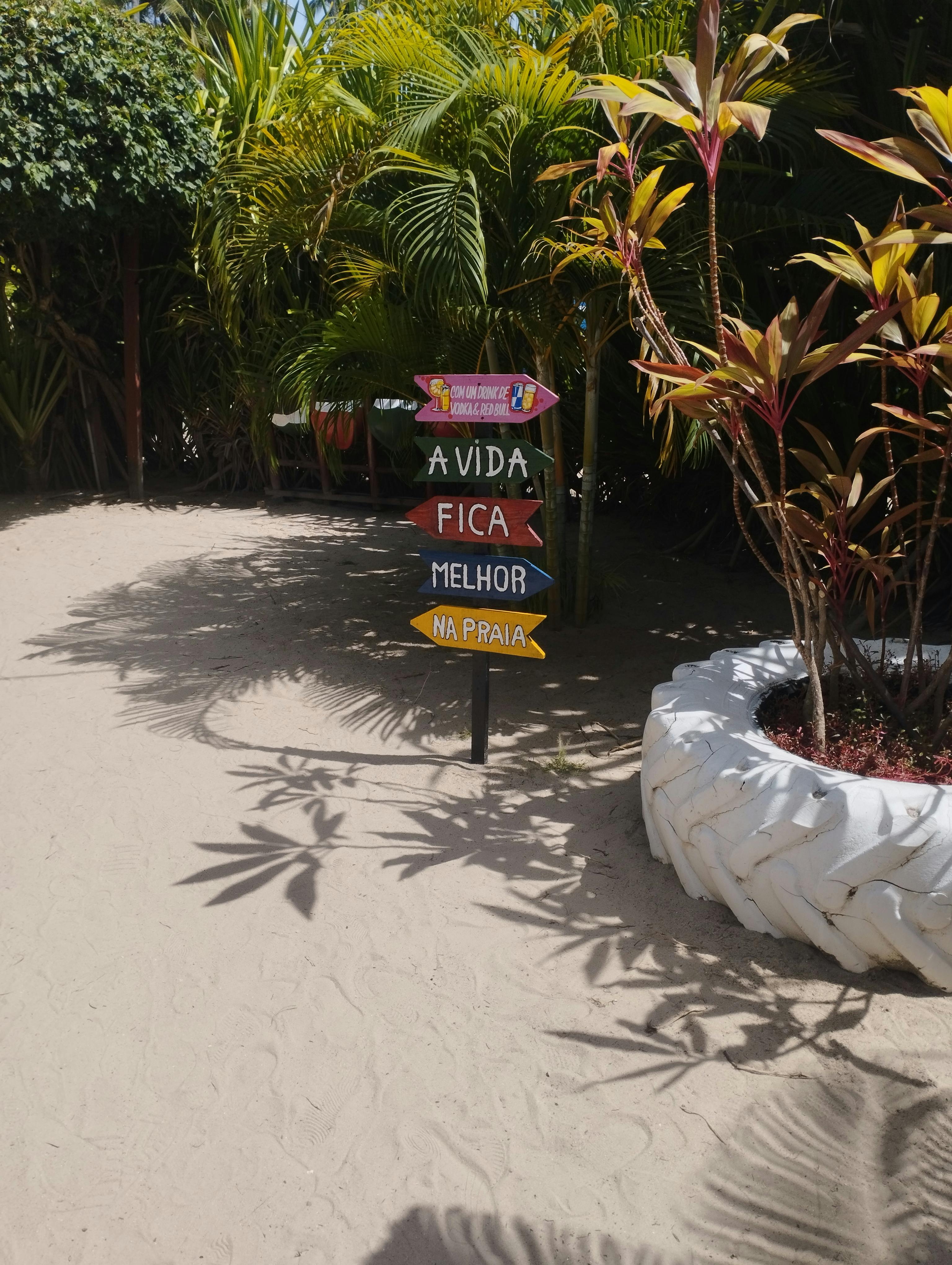 Colorful Sign on Tropical Sandy Beach