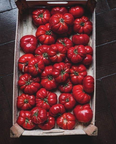 Fresh Heirloom Tomatoes in Wooden Crate
