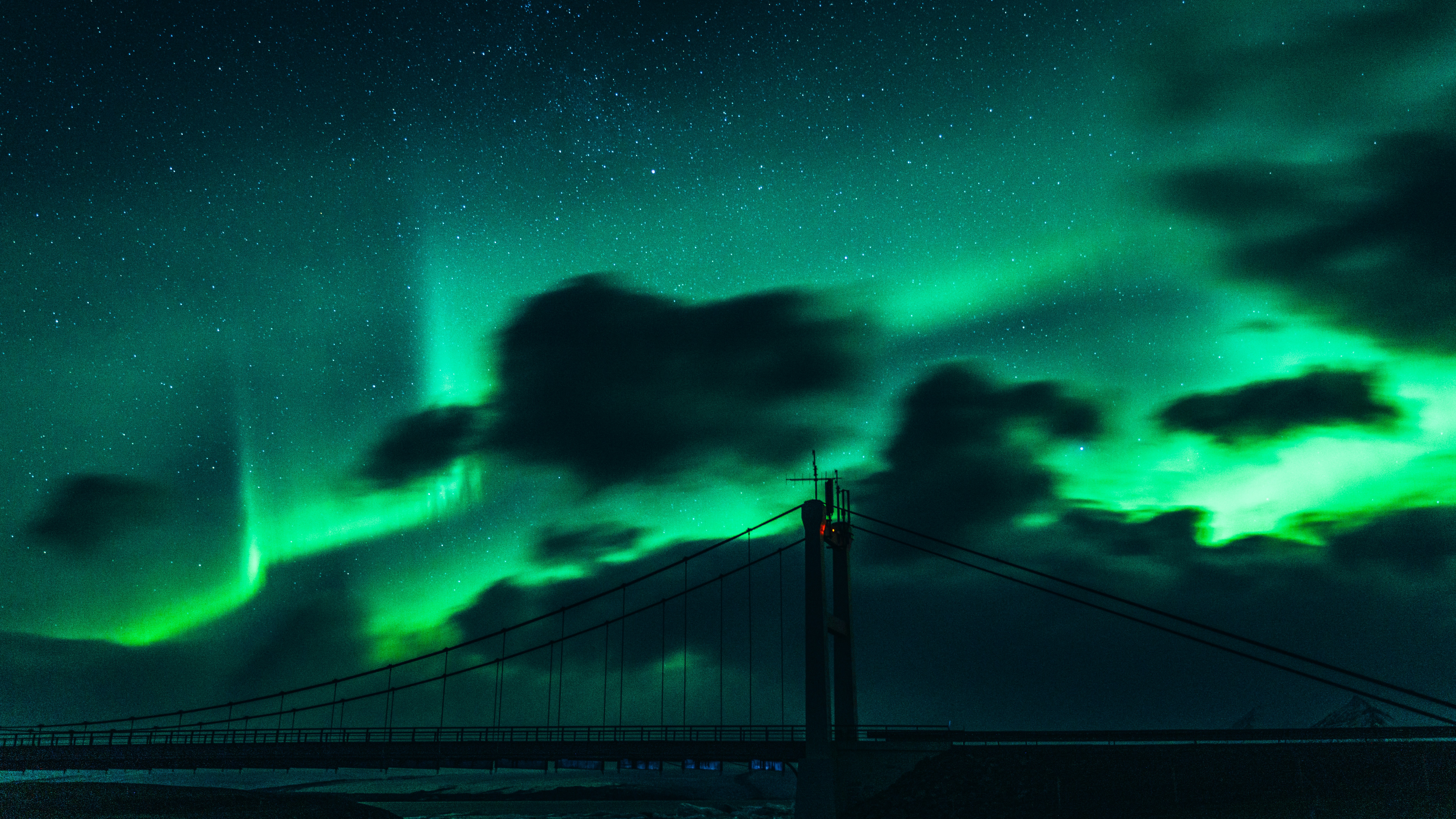 Aurora Over Suspension Bridge at Night