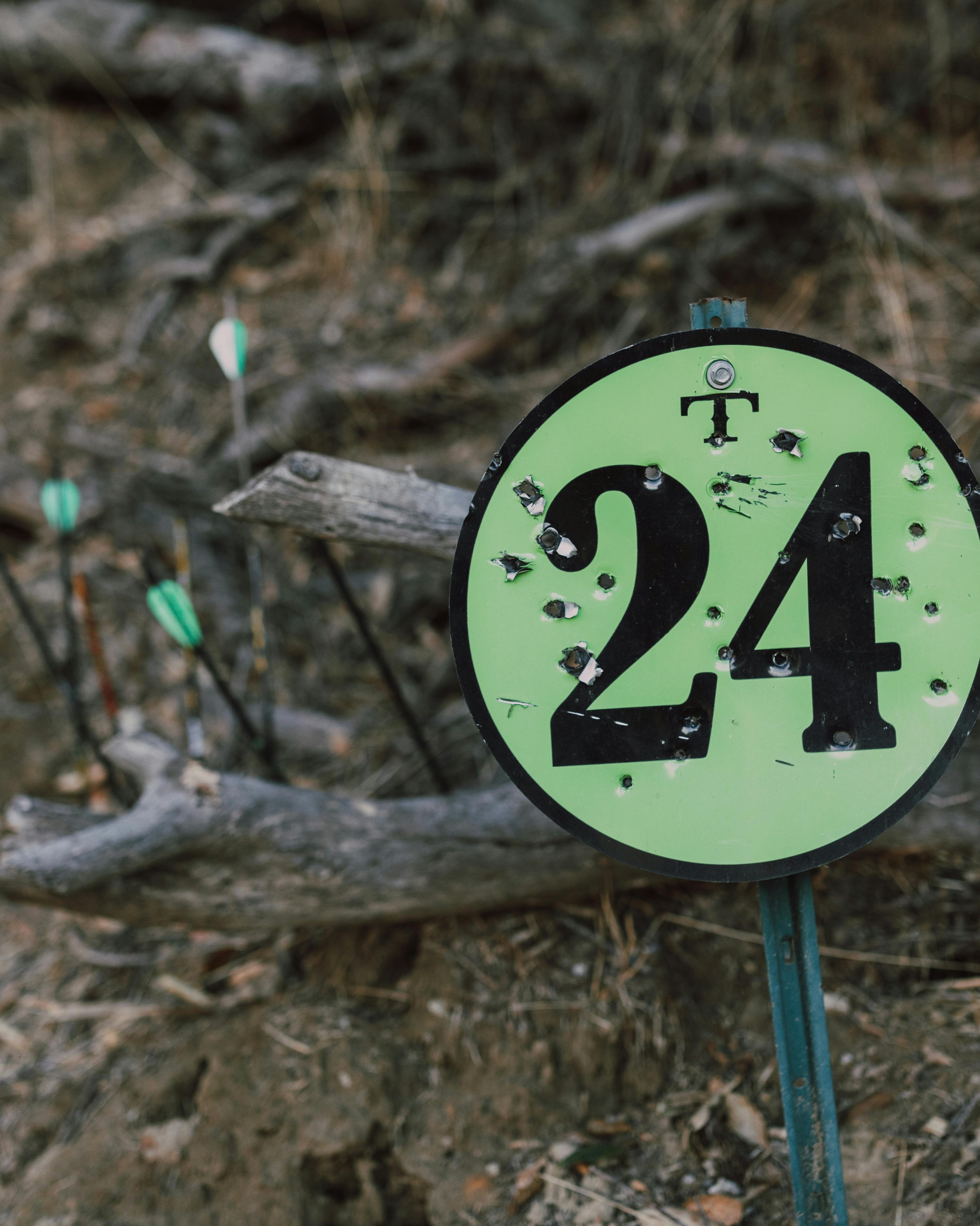 Bullet-Riddled 24 Archery Course Sign