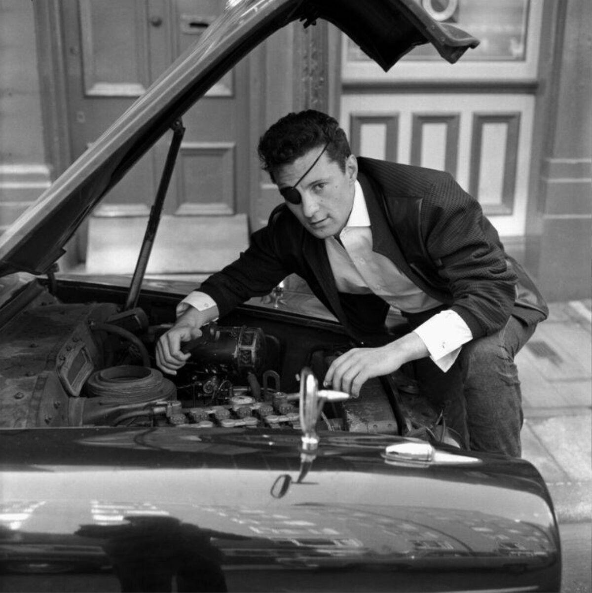 Man With Eyepatch Checking Car Engine