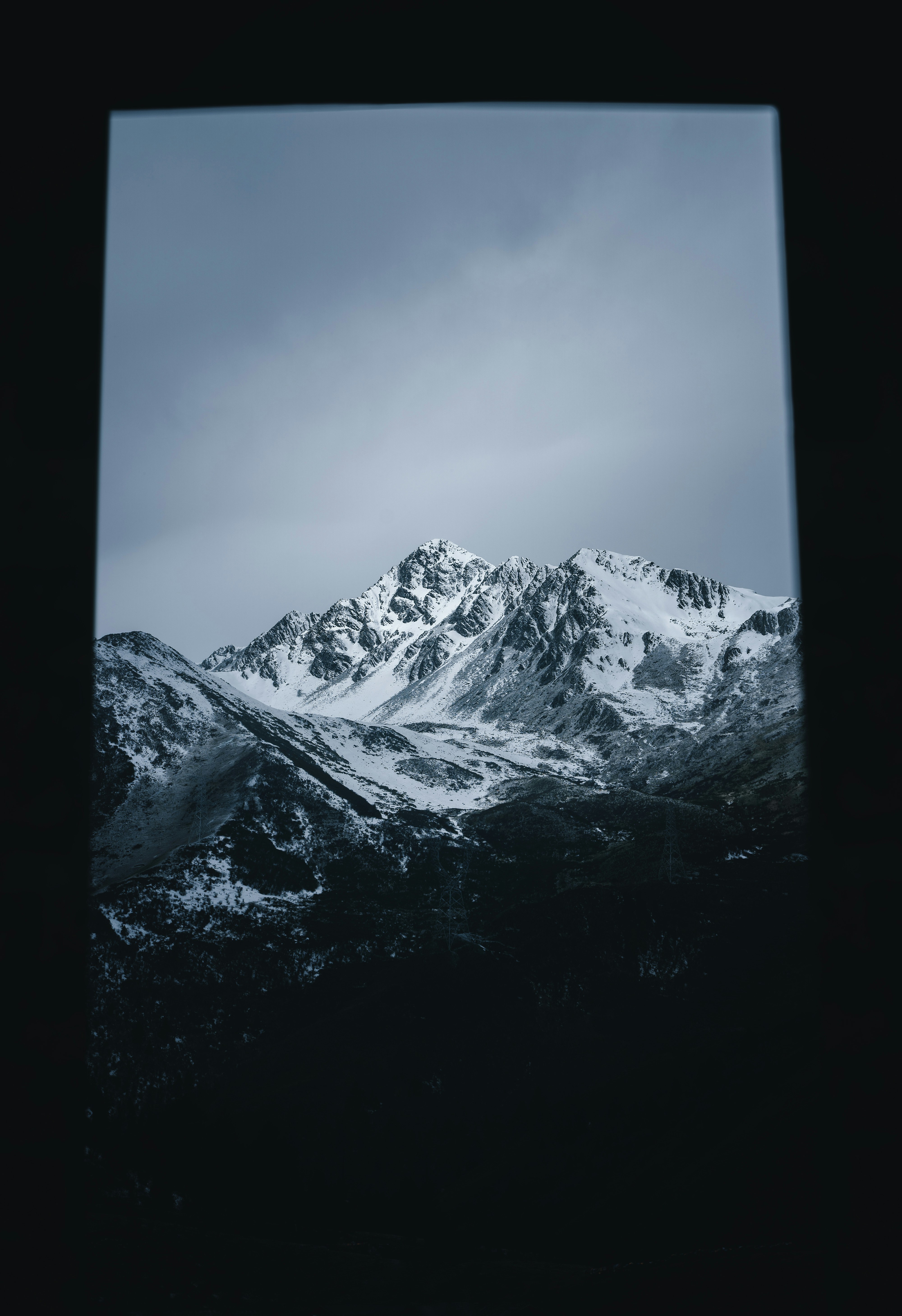 Snow-capped Mountains Through Window