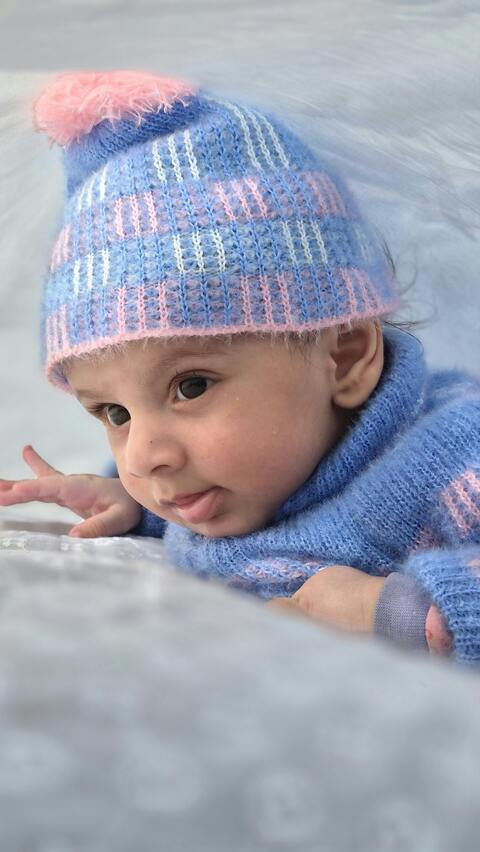 Baby Wearing Blue Knit Winter Hat