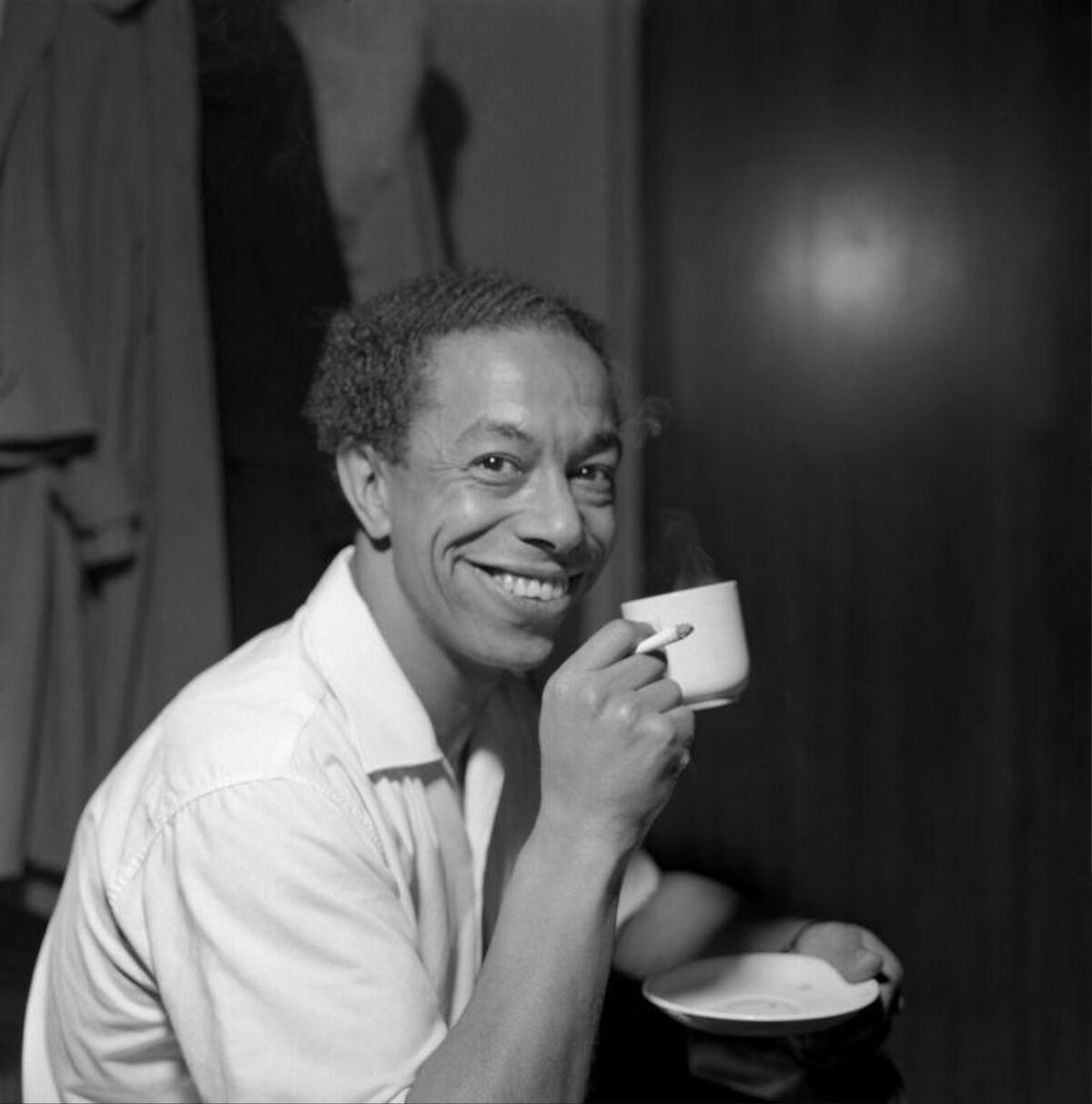 Smiling Man Holding Coffee Cup