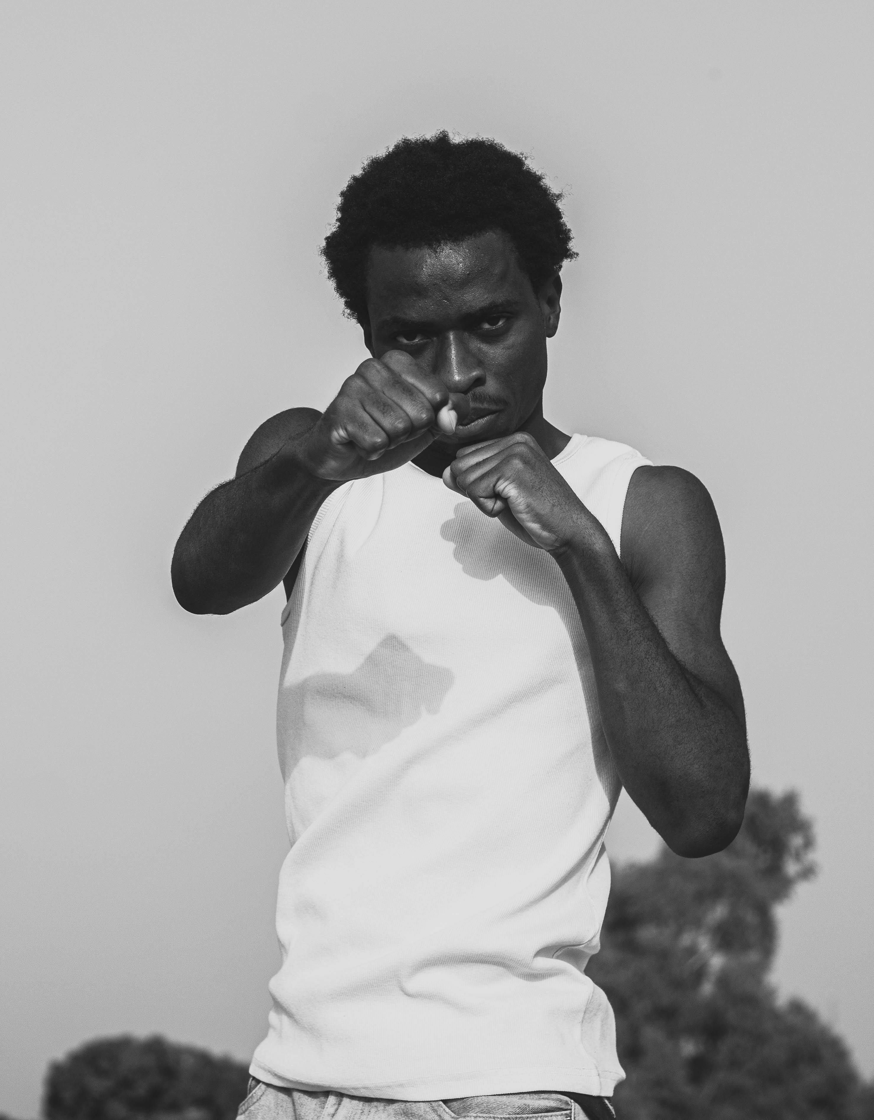 Man In Boxing Stance Outdoors