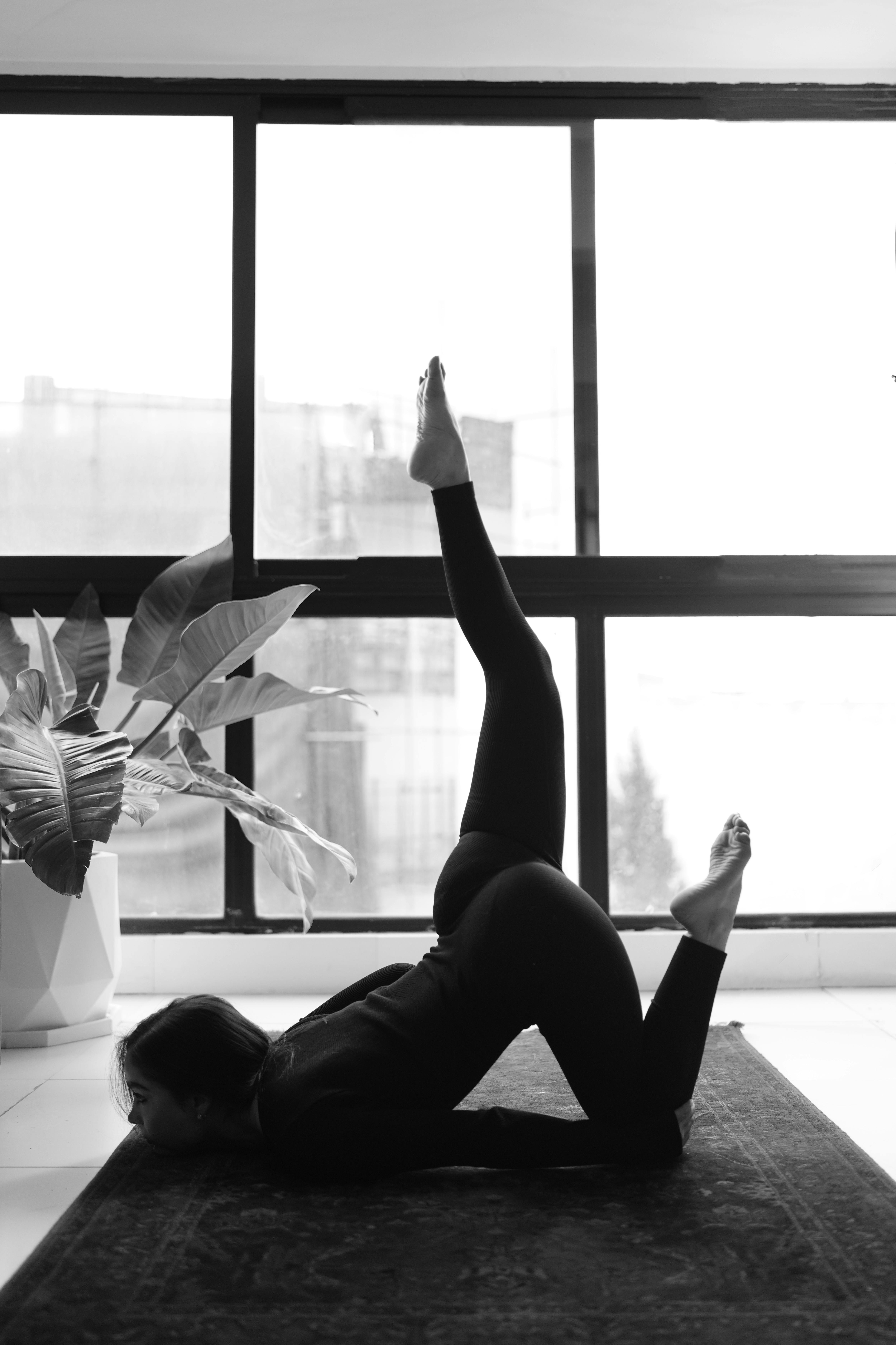 Woman Practicing Yoga Indoors