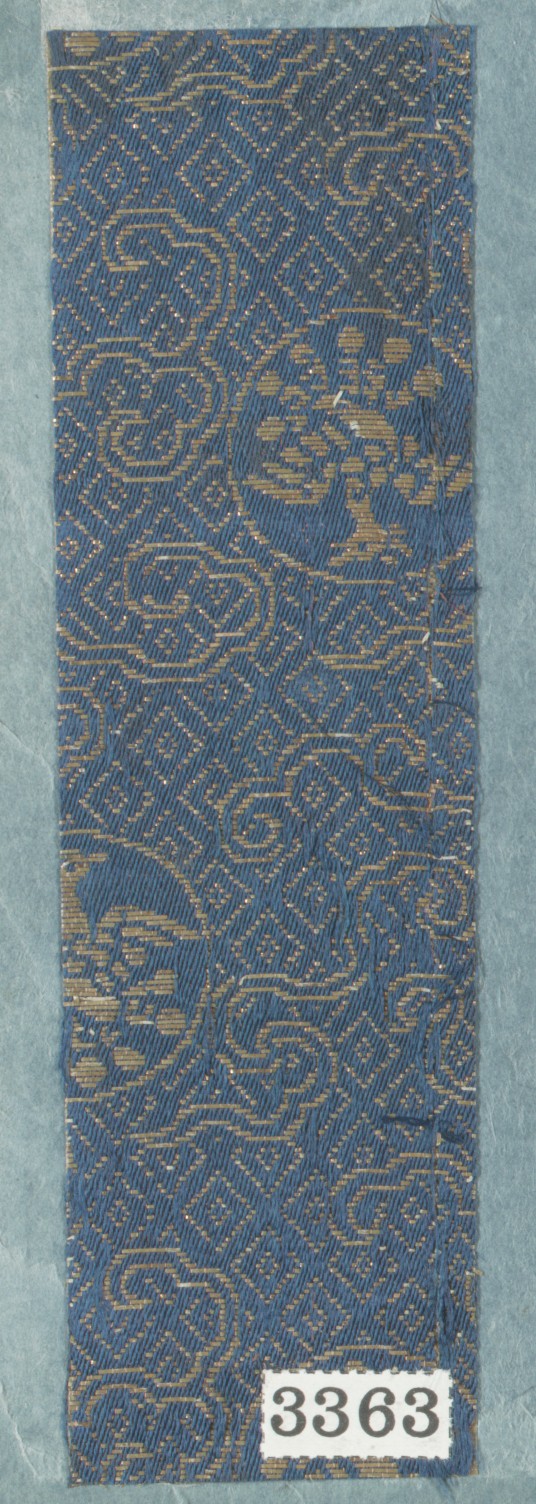 Blue and Gold Patterned Textile Sample