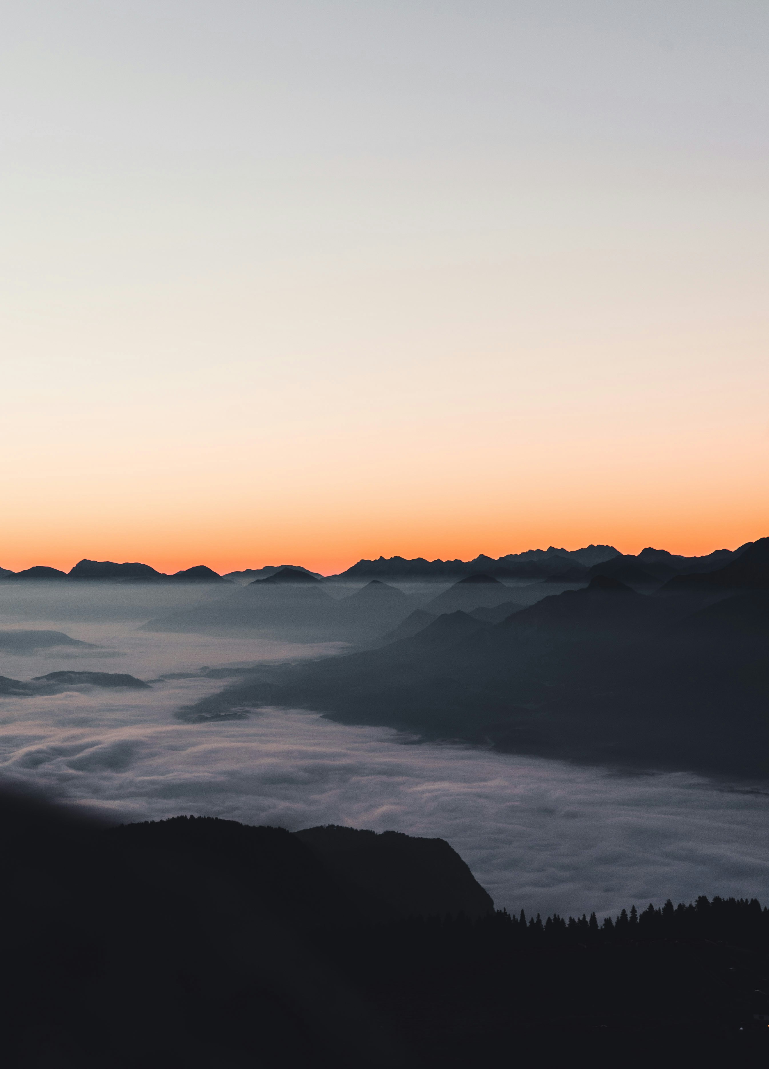 Mountains Above Sea of Clouds at Dawn