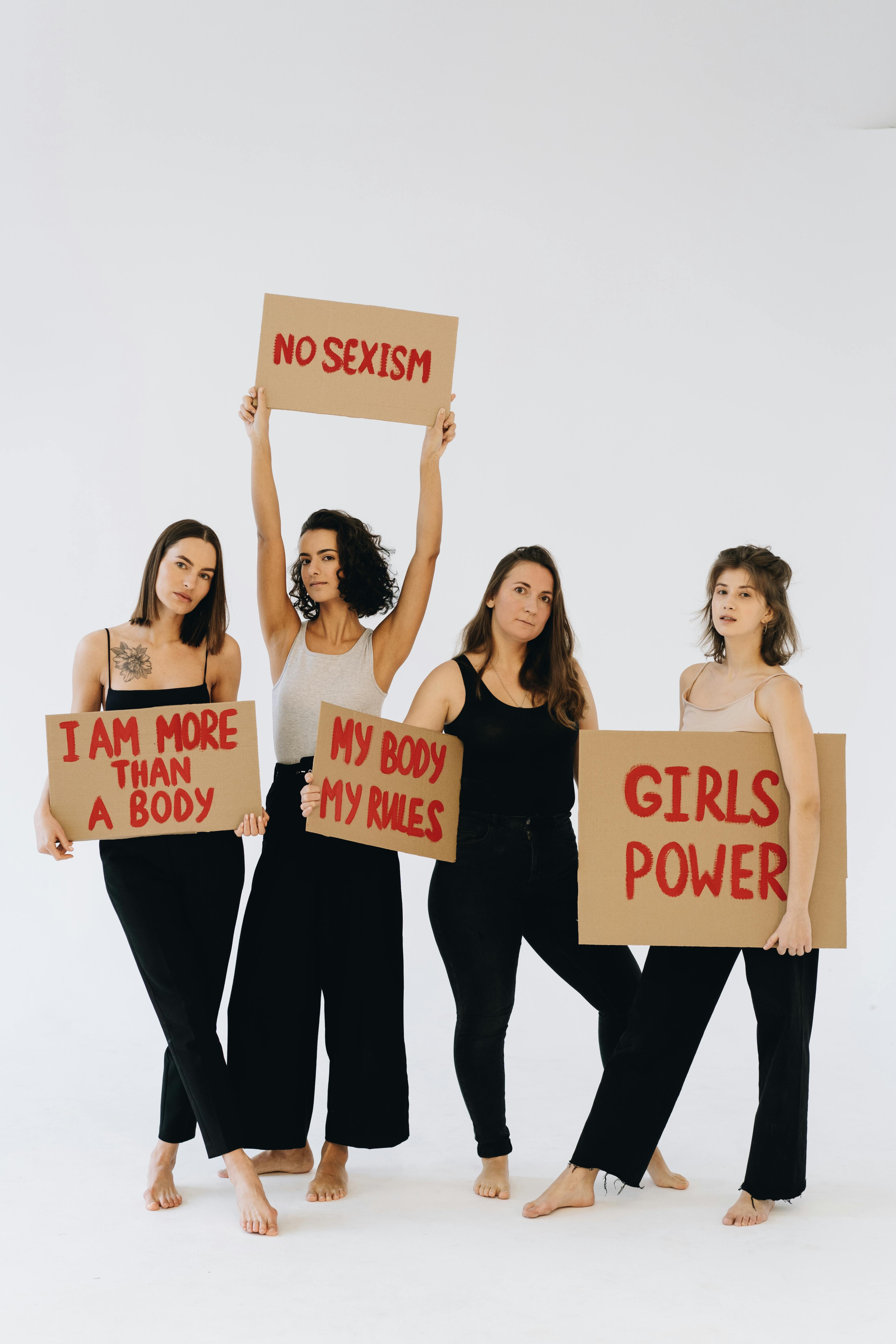 Women Holding Feminist Protest Signs