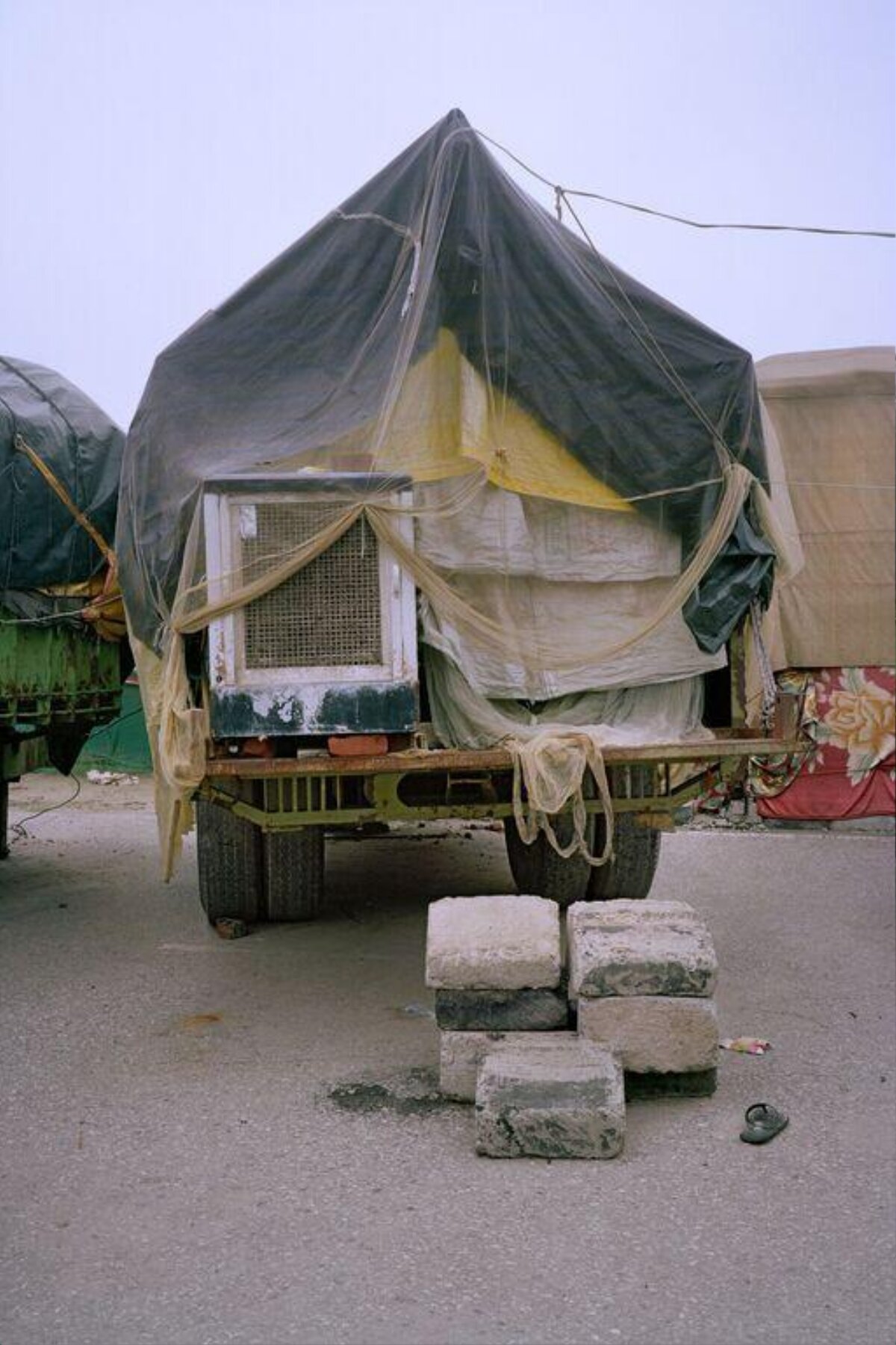 Homemade Shelter on Flatbed Truck — Cars