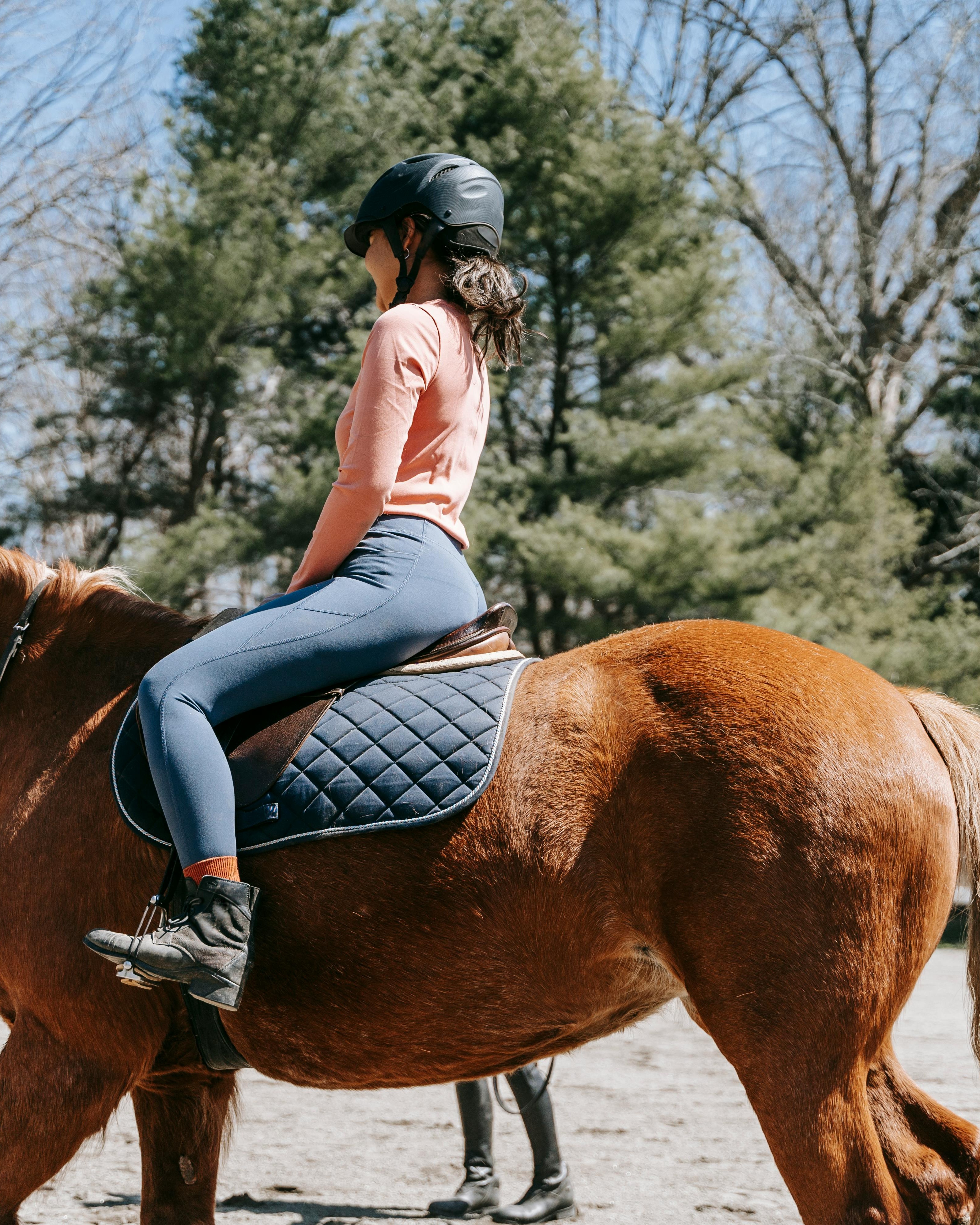 Woman Horseback Riding Outdoors