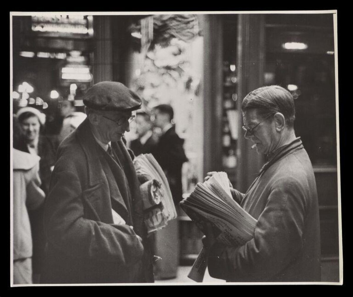 Two Men Reading Newspapers