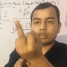 Man Gesturing In Front Of Whiteboard