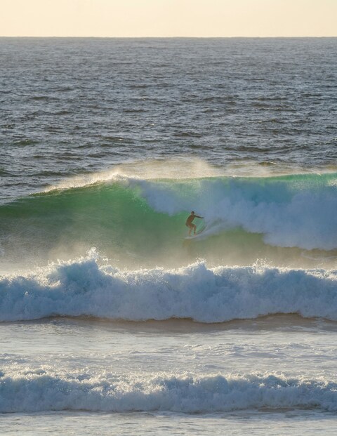 Surfer Riding Ocean Wave