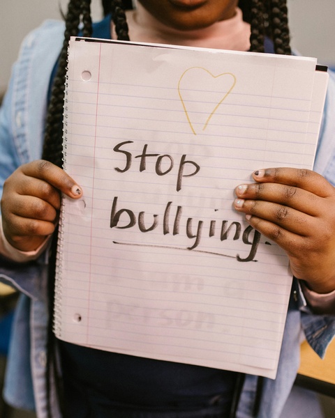 Student Holding Stop Bullying Sign