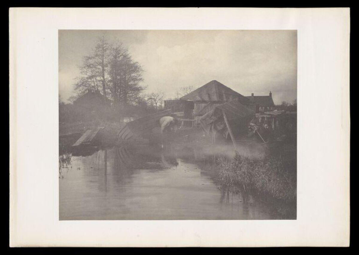 Misty Rural Riverbank with Farmhouse
