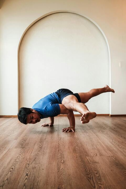 Man Performing Advanced Yoga Pose