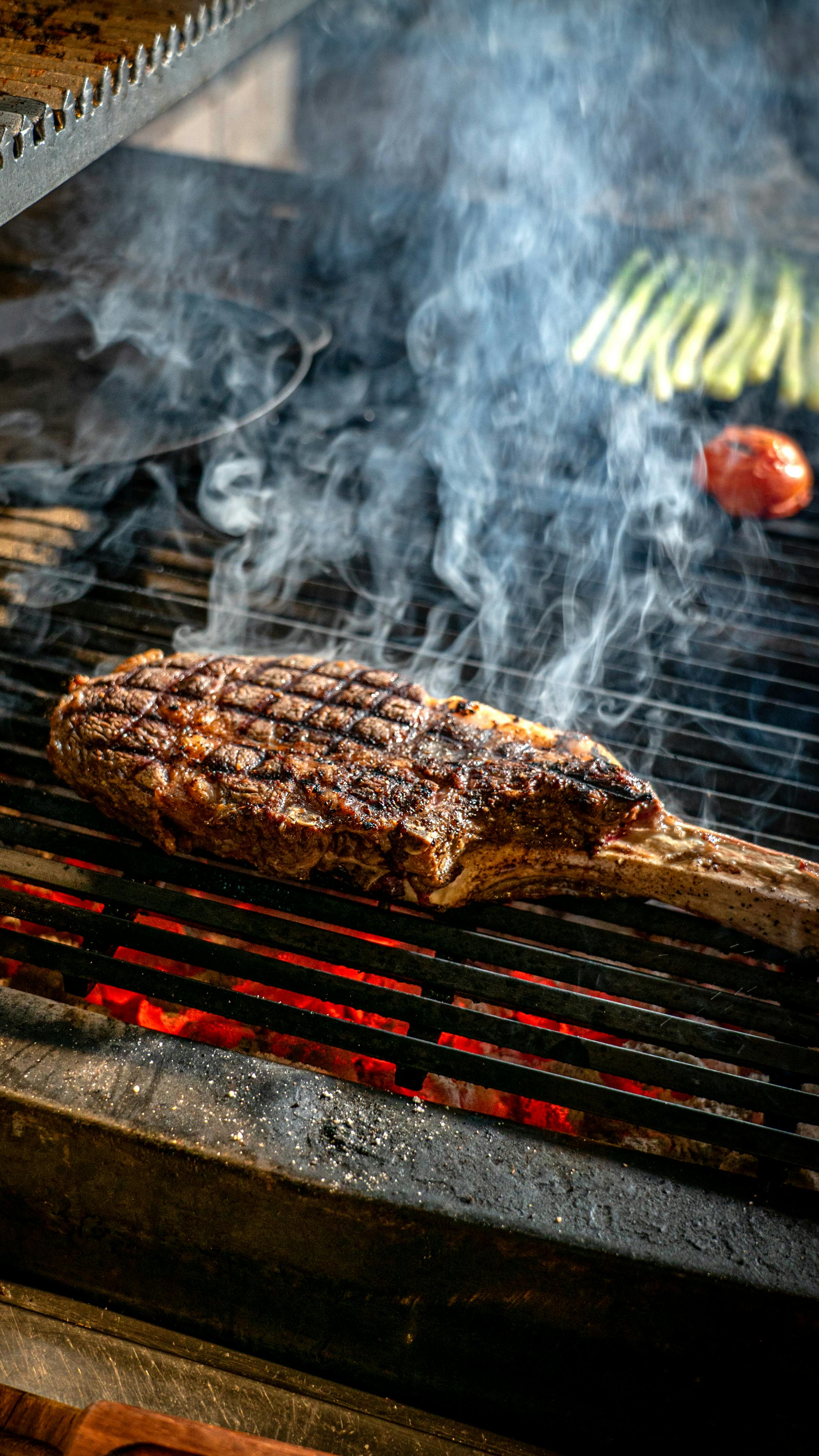 Grilled Tomahawk Steak on Charcoal Grill