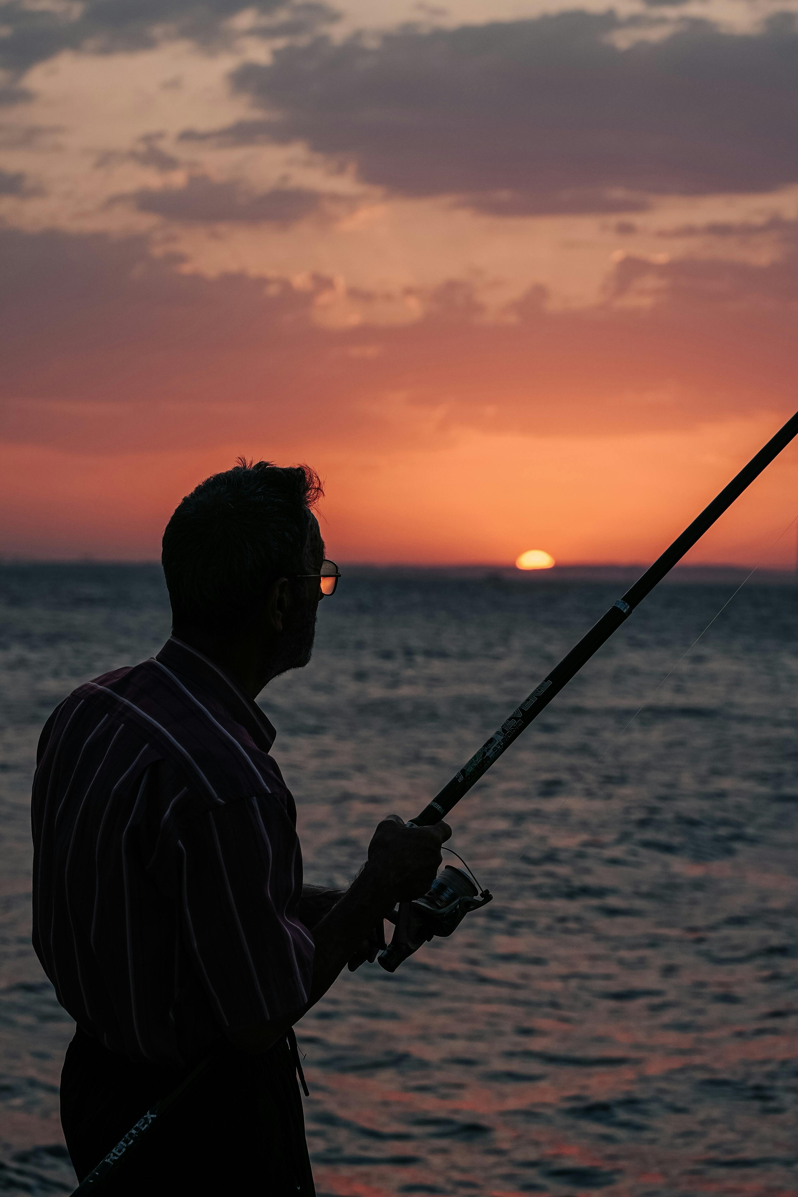 Man Fishing at Sunset