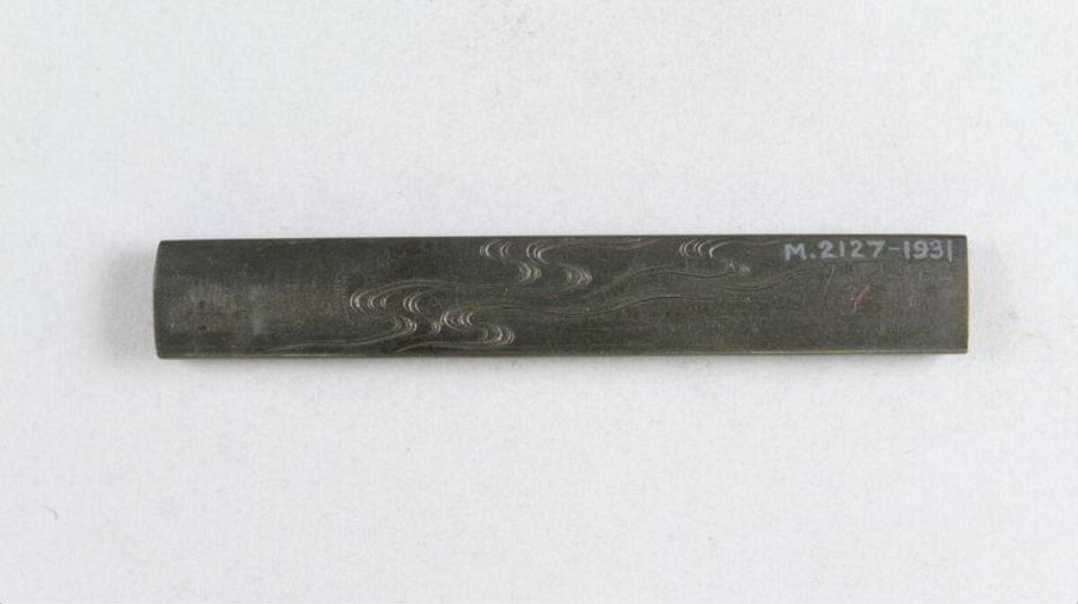Wave Pattern Engraved Bronze Artifact