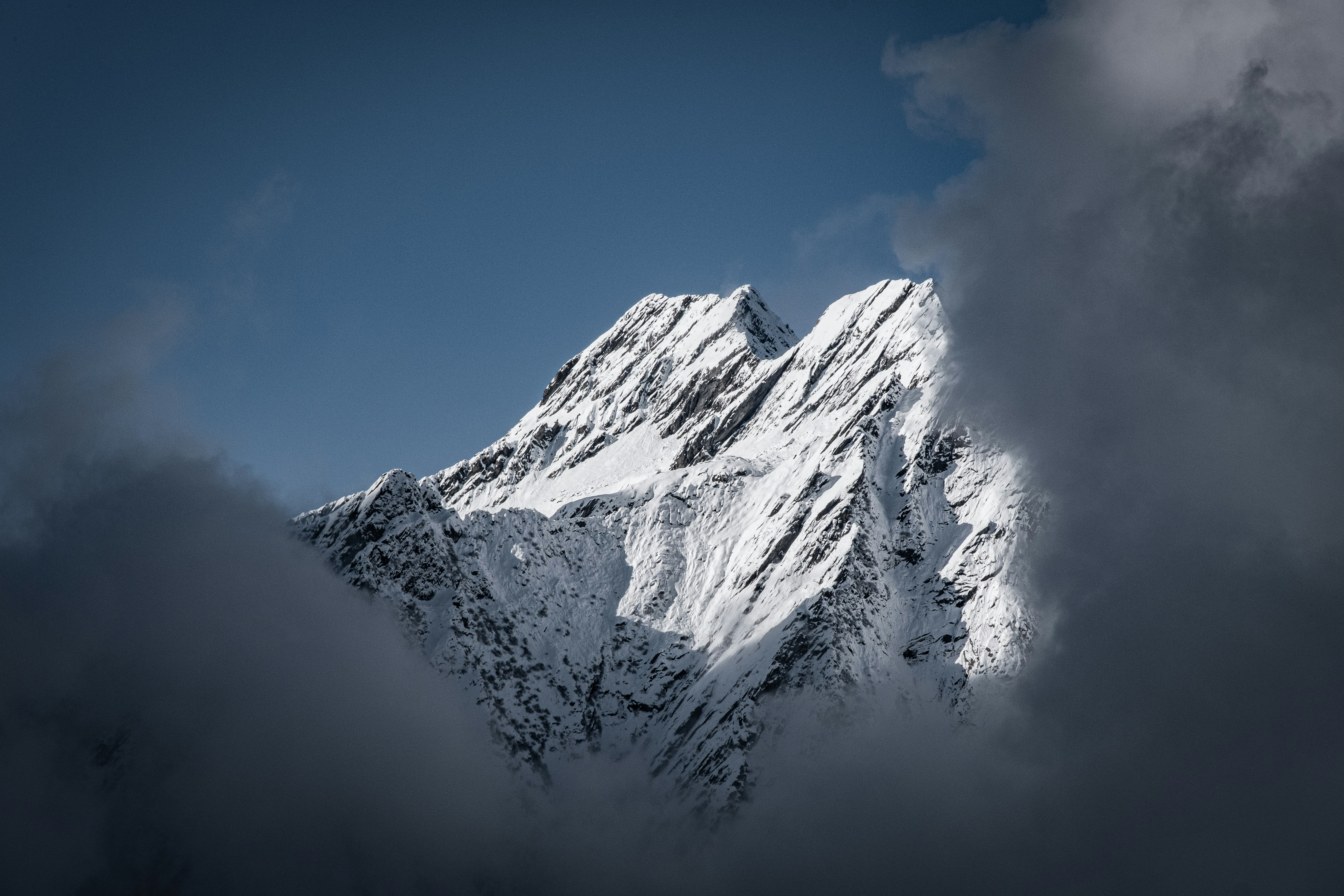 Snow-capped Peak Above Clouds