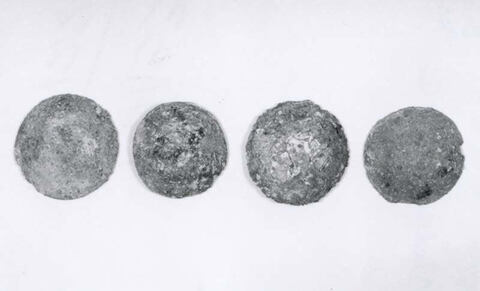 Four Weathered Round Iron Balls