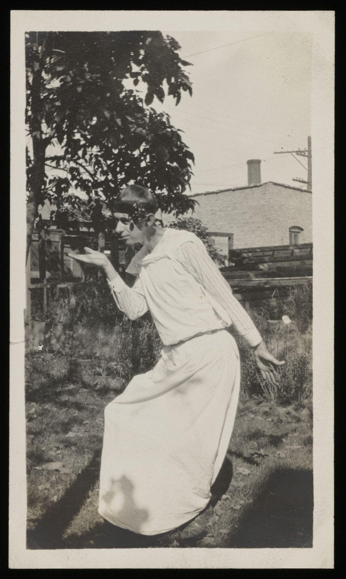 Man in Costume Posing in Backyard