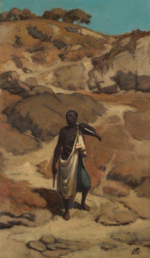 African Hunter in Dry Ravine