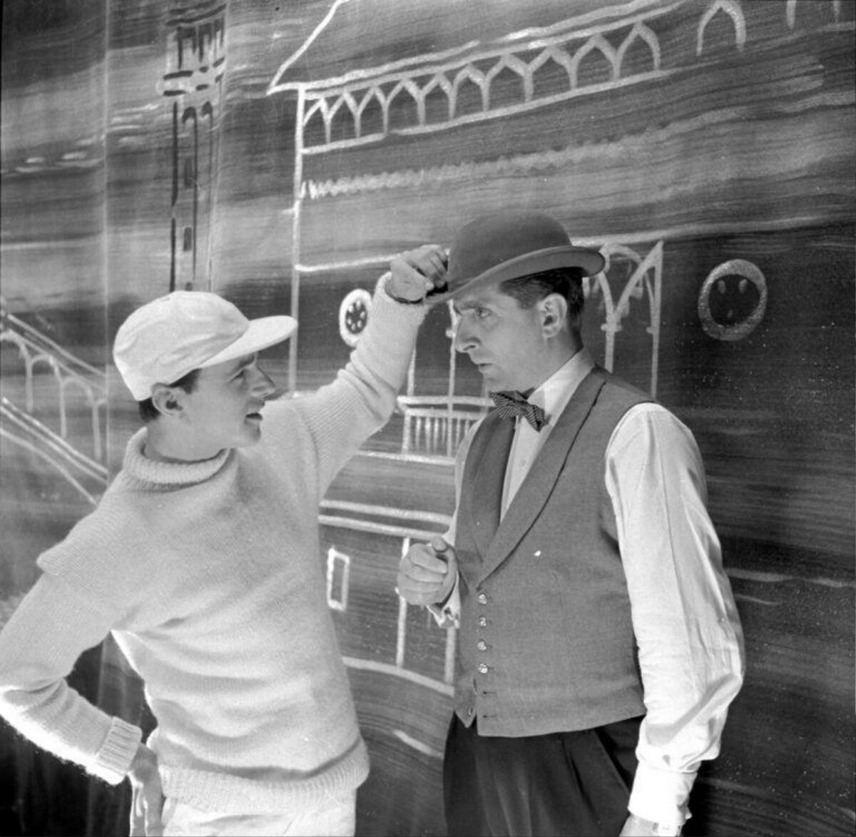 Two Men Interacting on Theatre Stage