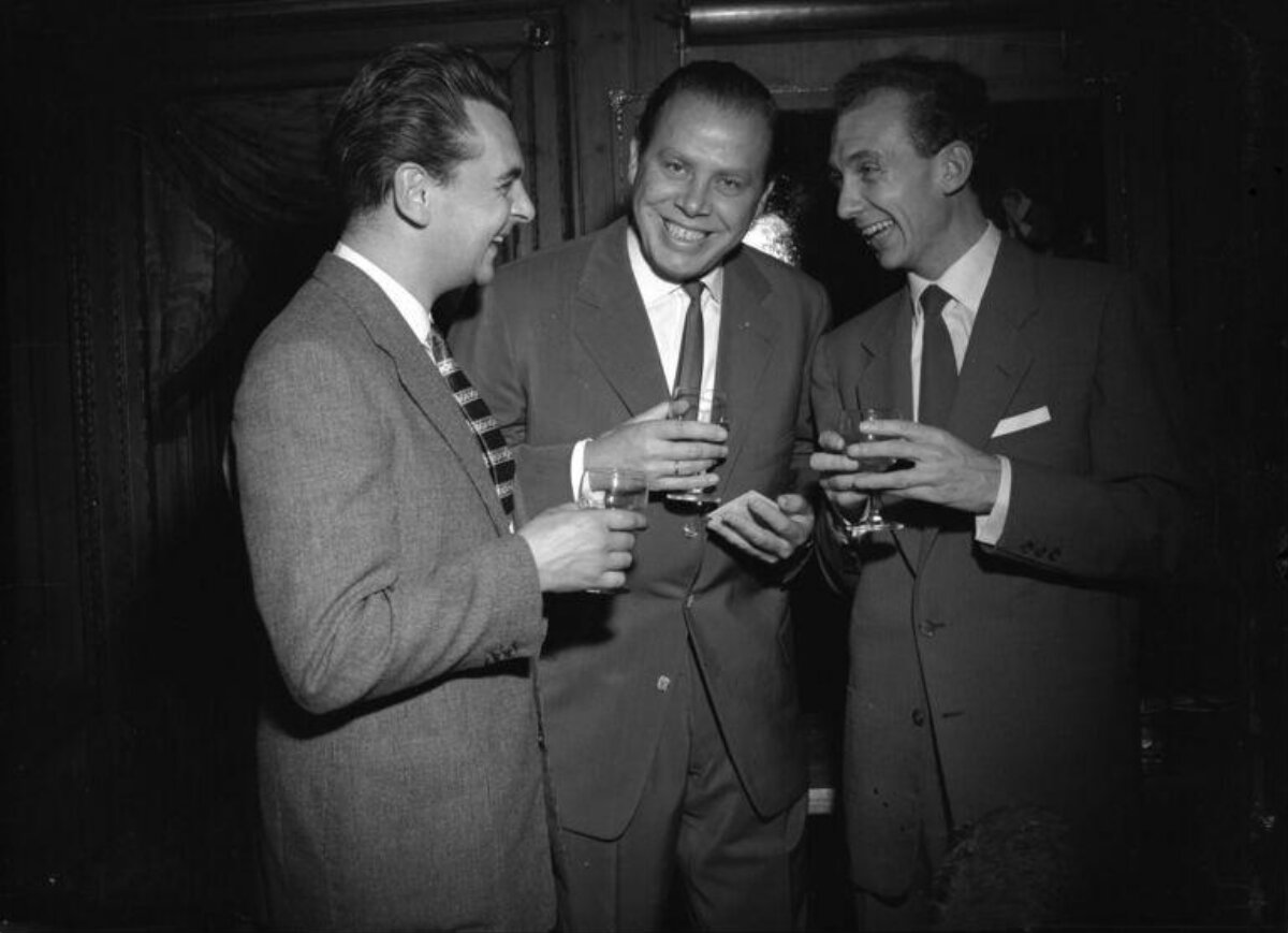 Three Men in Suits Toasting