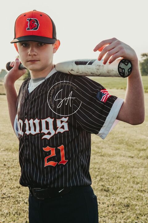 Youth Baseball Player Posing Outdoors