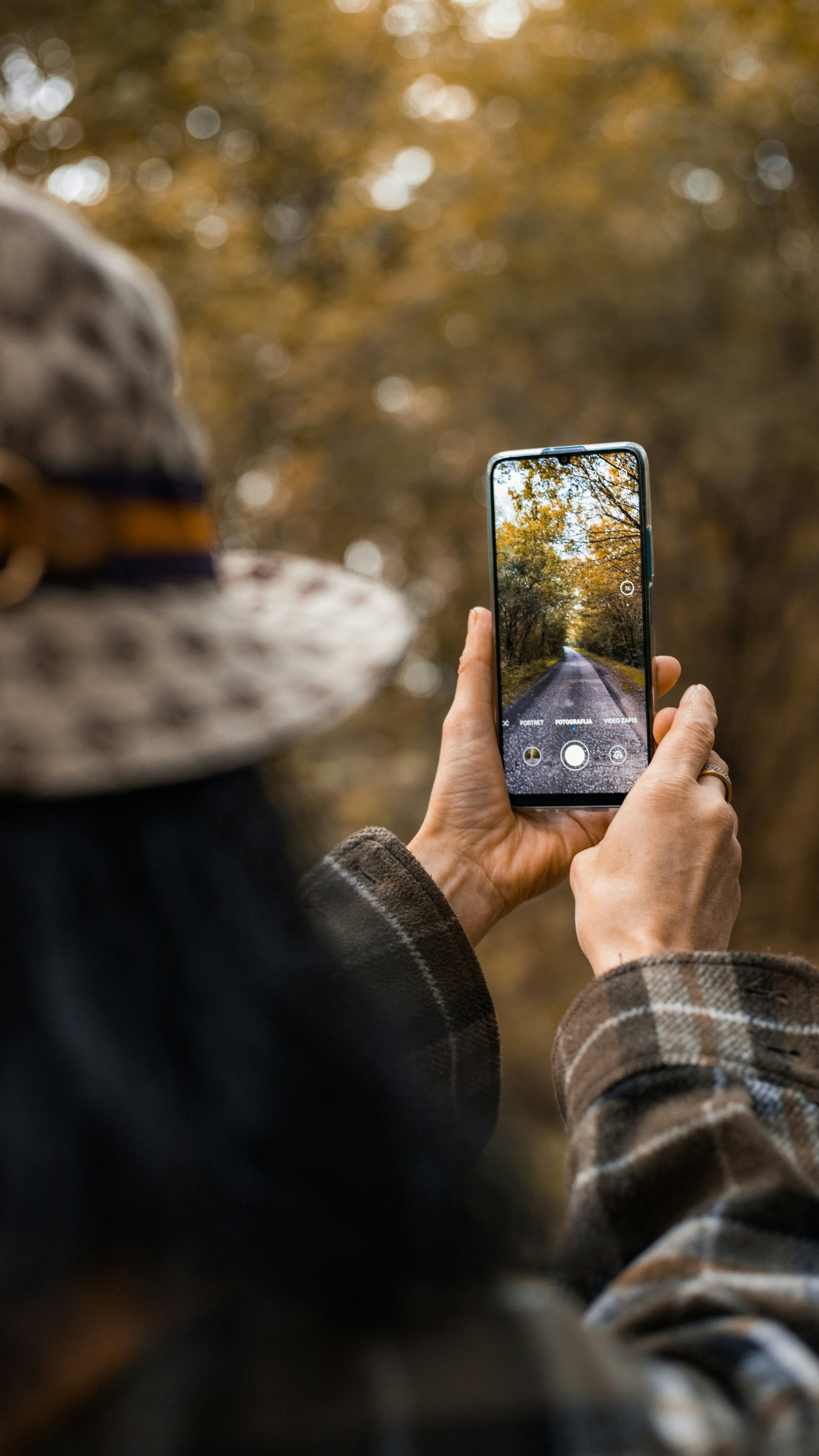 Taking Photo of Autumn Forest Path